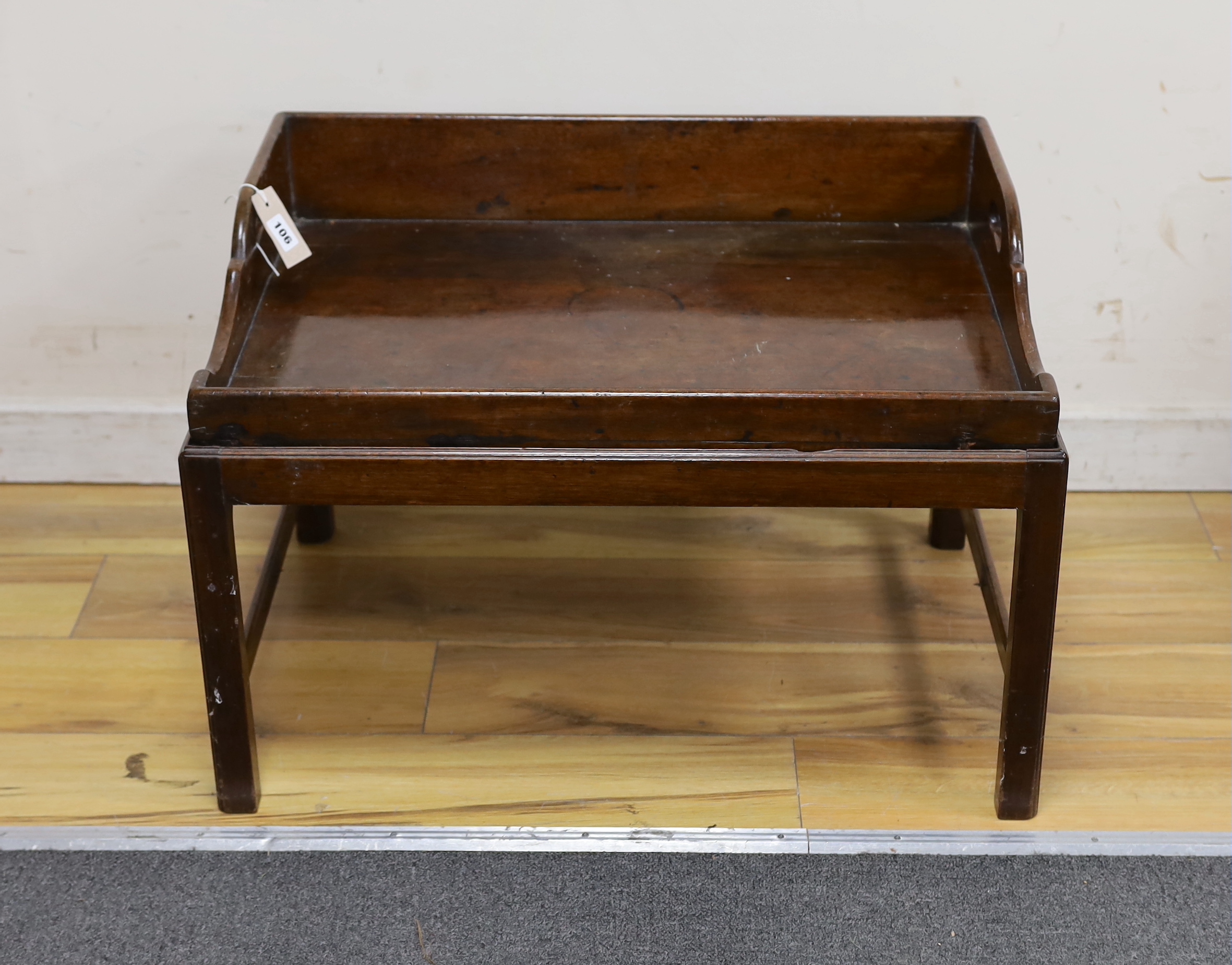 A Victorian rectangular mahogany butler's tray on associated stand, width 69cm, depth 50cm, height 47cm